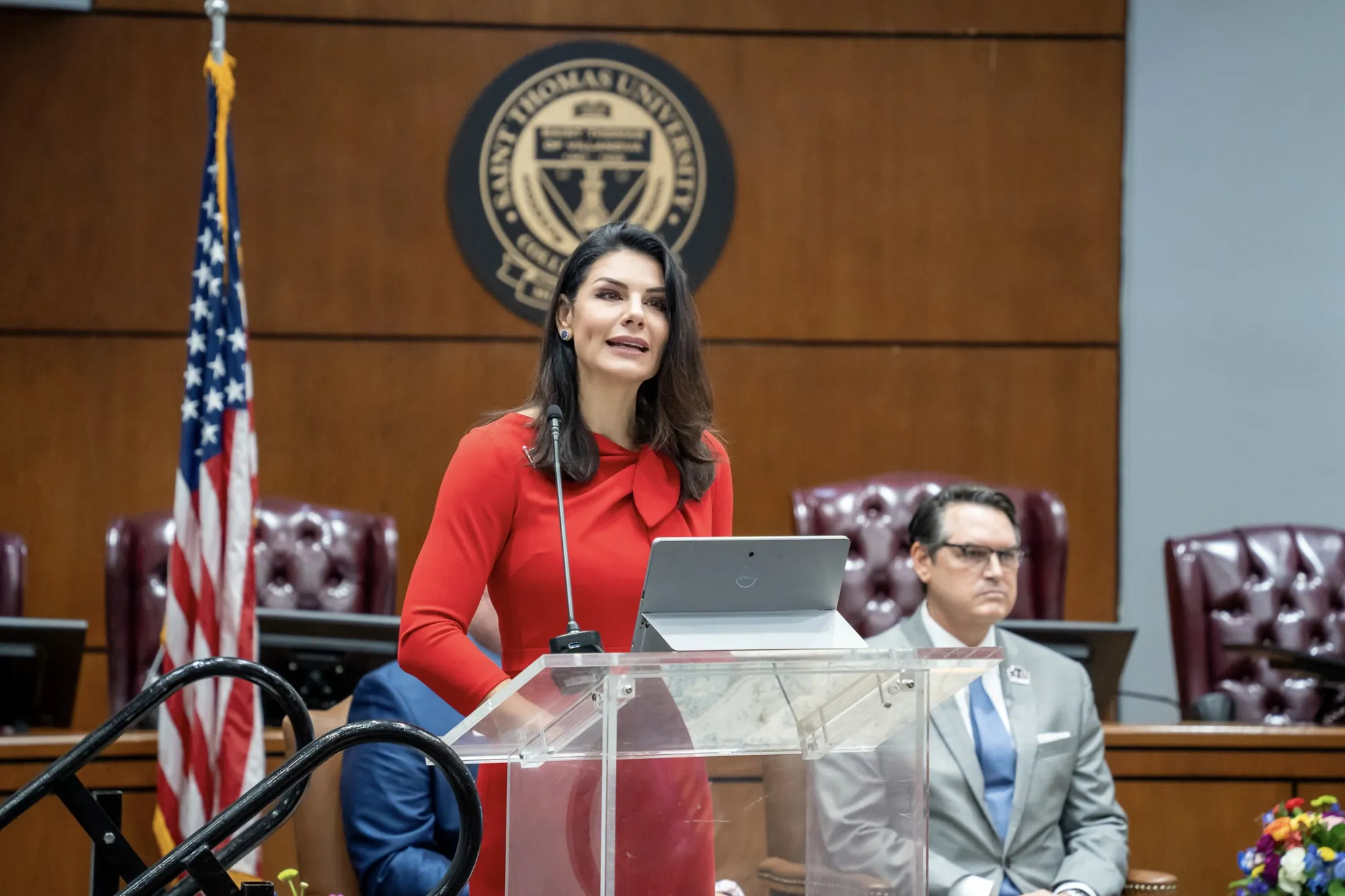 Nuñez-Navarro speaking at a podium